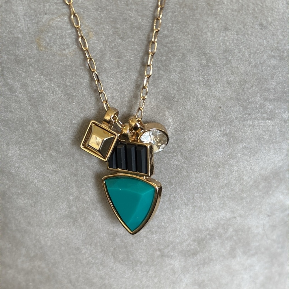 NWOT Kardashian gold tone necklace with multi charm pendant and extender chain